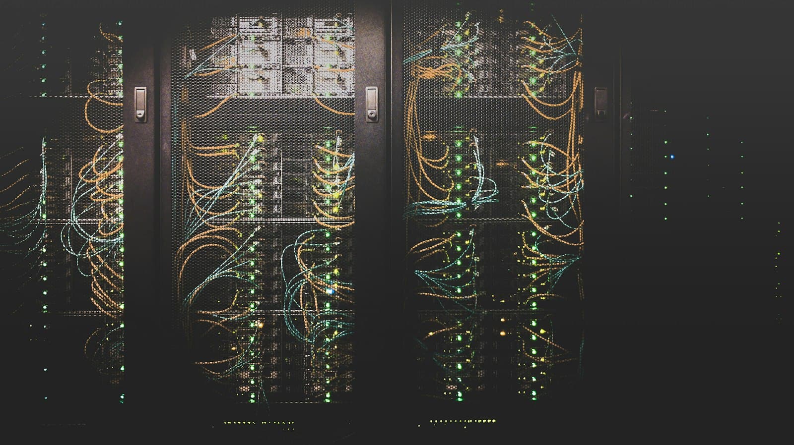 Rows of server racks with network cabling in a data centre