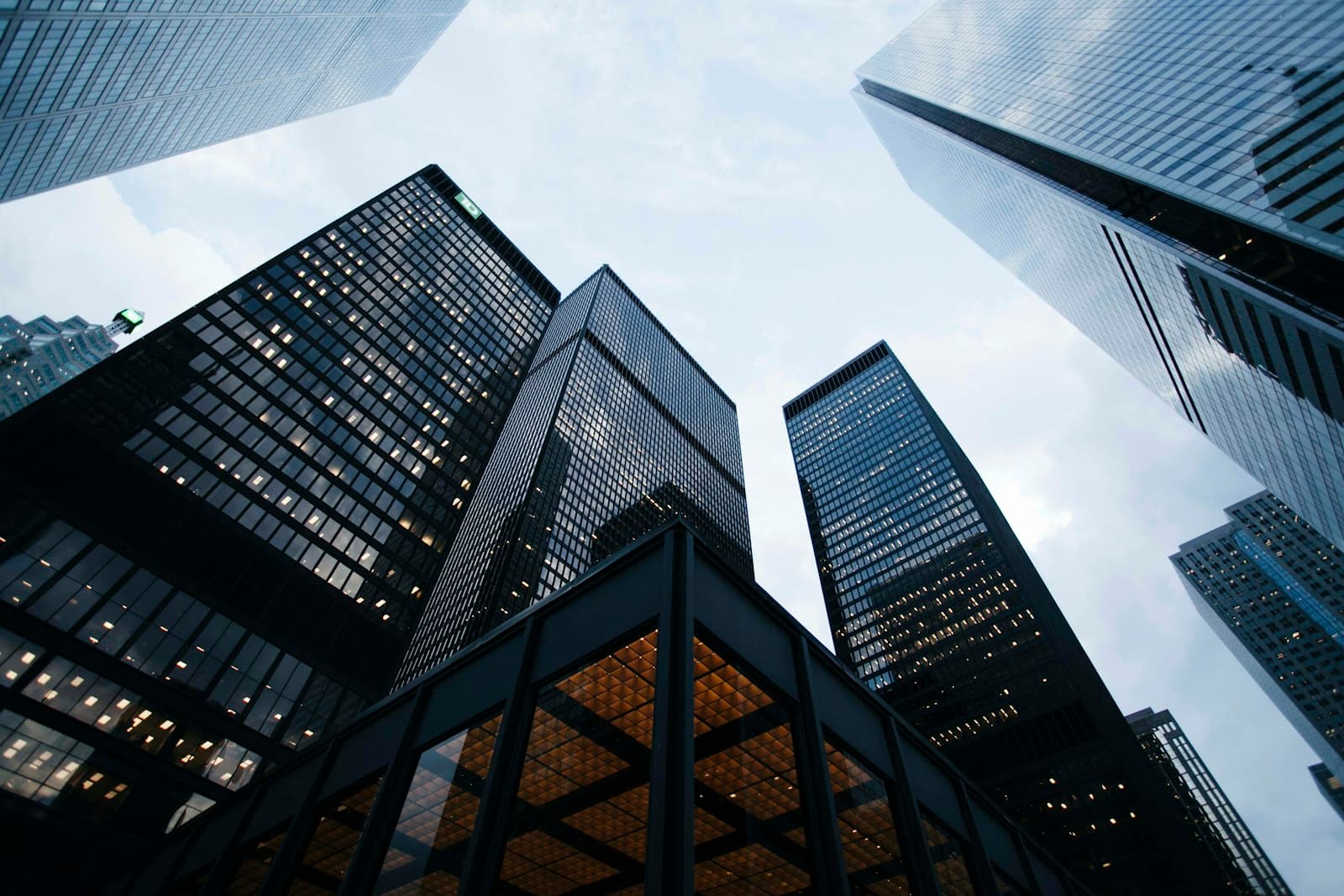 Glass office towers in a financial district seen from street level